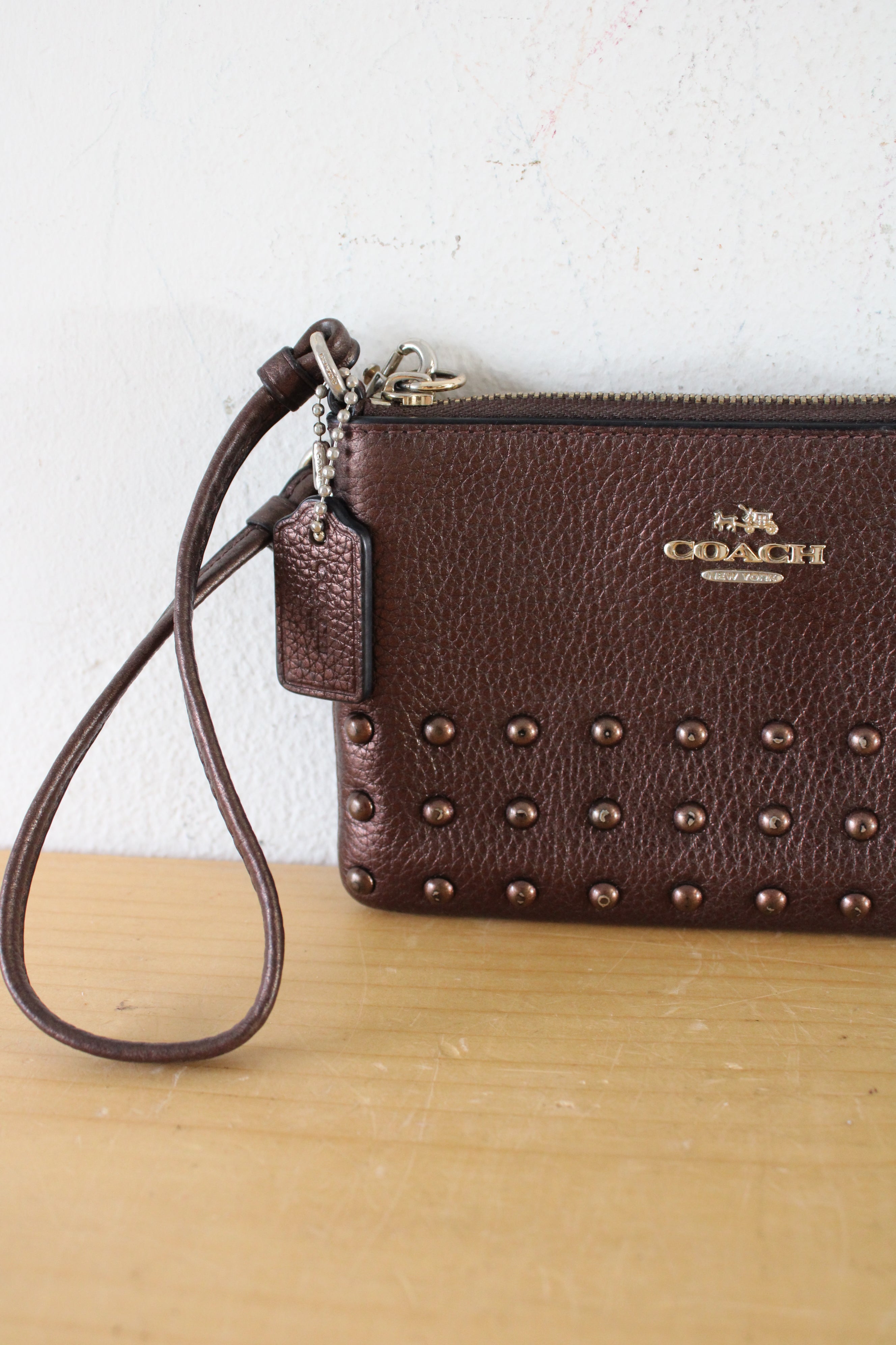 Coach Bronze Studded Wristlet