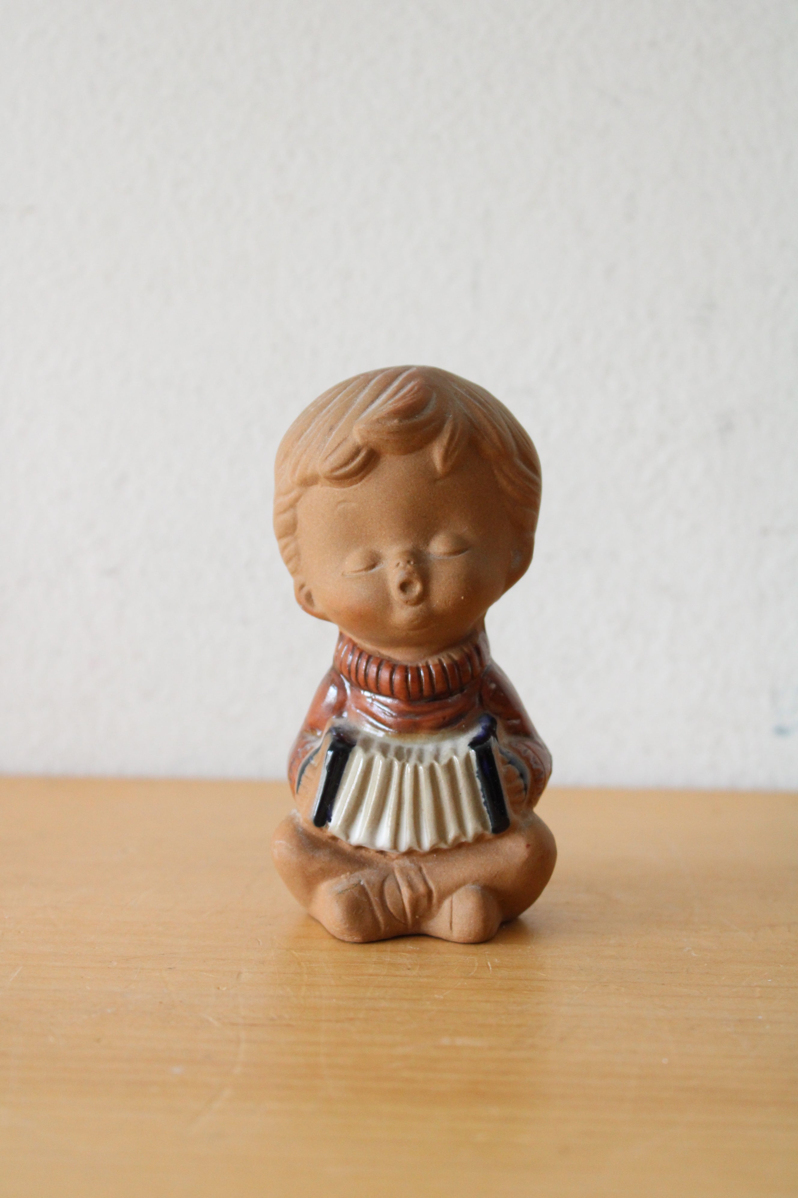 Ceramic Boy Playing Accordion Figurine