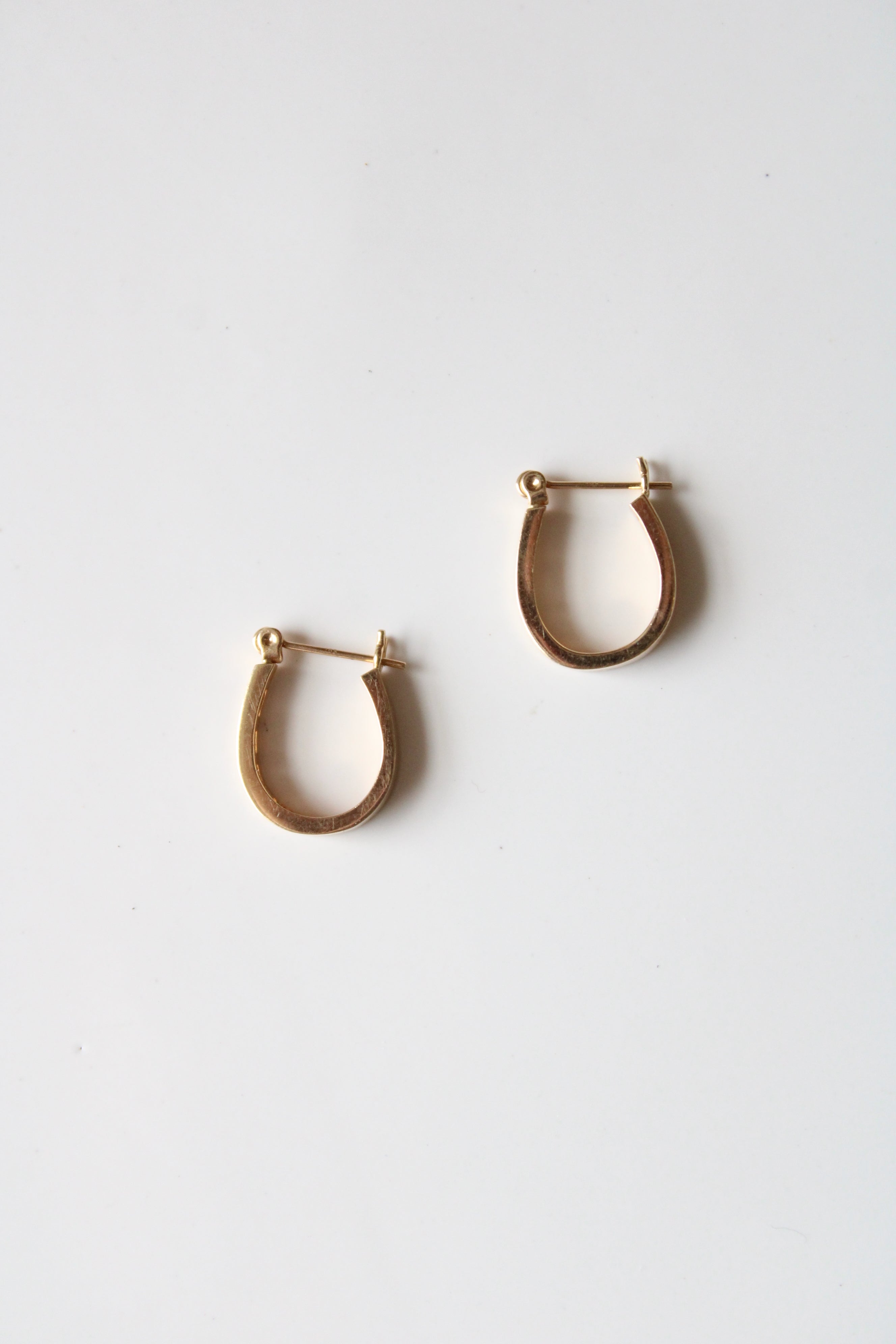 14K Yellow Gold Crystal Inset Oval Hoop Earrings